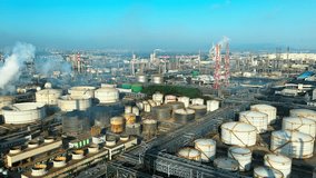 Aerial shot of an oil refinery and chemical plant with storage tank in a large industrial area - Powered by Shutterstock - Get 15% off with code: PIKWIZARD15