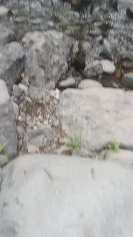 A River, waterfalls on a foggy day inside a mountain 