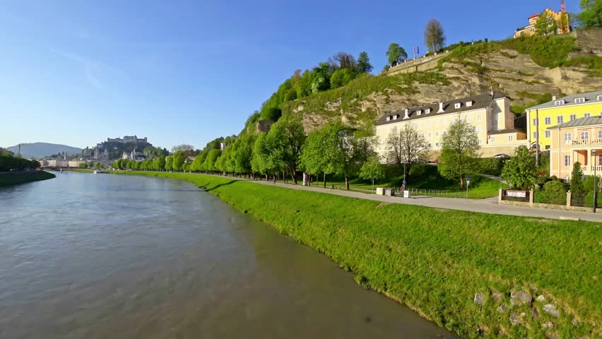 Scenic view of Salzburg Austria along the Salzach River on a bright sunny day