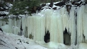 Vertical Ice Sheets Formed On The Cliffs Of Eben Ice Caves In Michigan, USA. - zoom in shot - Powered by Shutterstock - Get 15% off with code: PIKWIZARD15