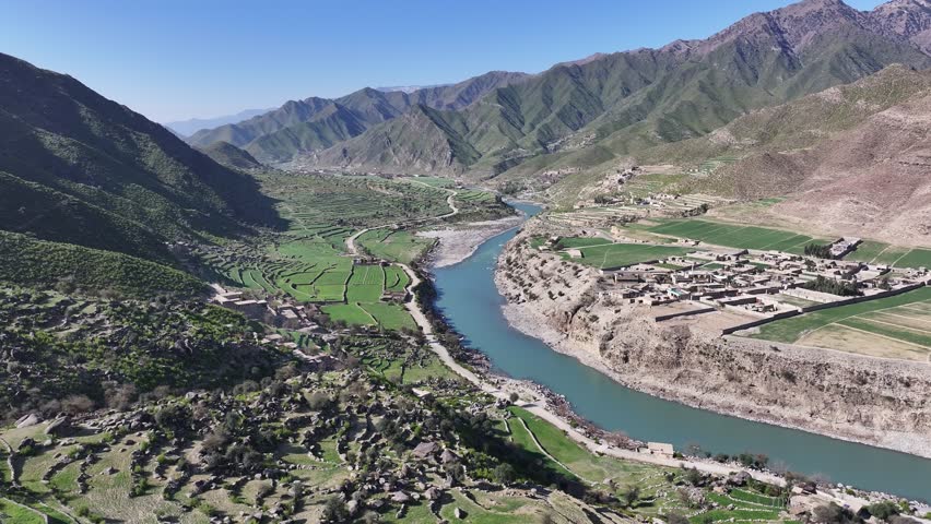 Asmar District, Kunar river valley drone aerial with beautiful Hindu Kush mountains, forests and village, Afghanistan