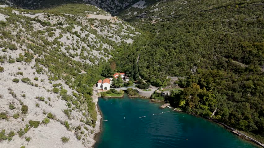 Aerial Drone View of Wild Croatian Landscapes. Rugged coastline, untouched forests, green hills and the deep blue Adriatic Sea creating breathtaking natural scenery from above