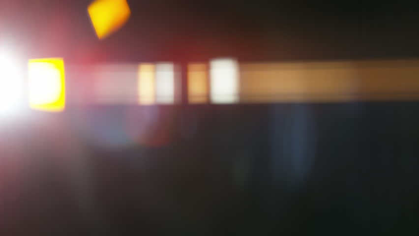 Real Shooted Cinematic Lens Flare Overlay on Black Background at 1000fps Slow Motion.