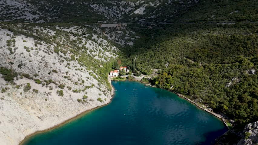Aerial Drone View of Wild Croatian Landscapes. Rugged coastline, untouched forests, green hills and the deep blue Adriatic Sea creating breathtaking natural scenery from above