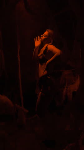 Night scene. Woman dancing in spider web on Halloween.