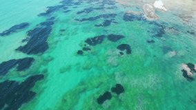 Aerial drone footage of Scala dei Turchi, Sicily: white marl cliffs descending into turquoise sea, coastal waves and dramatic Mediterranean light. Ideal for travel, nature, and heritage projects. - Powered by Shutterstock - Get 15% off with code: PIKWIZARD15