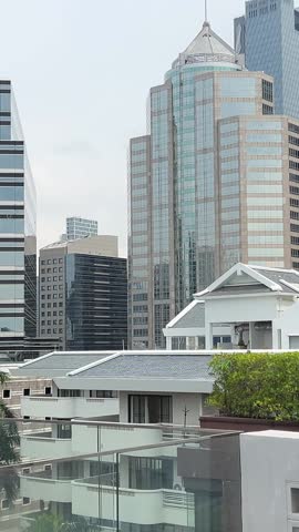 High rise hotels in Bangkok Thailand with glass windows city skyline modern urban architecture