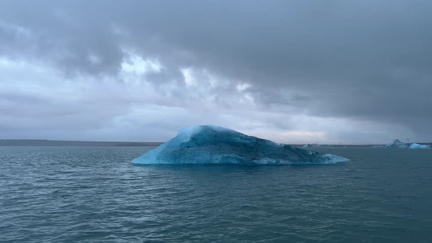 A small melting iceberg on the cold shoreline of Iceland