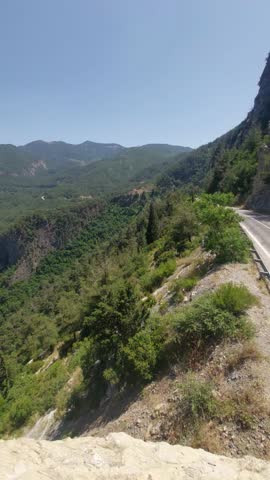 A scenic view from Cebel Plateau, İniş Dibi area in Osmaniye, Turkey — where mountain roads wind through lush green forests and pure air fills the landscape. This peaceful highland region captures the