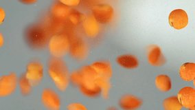 Slow motion macro video of red lentils falling and forming a pile. Detailed close-up view of orange lentil grains used in vegan, organic and healthy cooking. - Powered by Shutterstock - Get 15% off with code: PIKWIZARD15