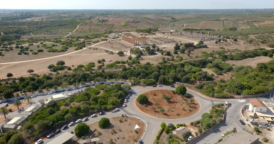 Aerial view of the Temple of Hera located at the archaeological site of Selinunte, in the province of Trapani, Sicily, Italy. In the foreground is a large parking lot and the museum entrance.