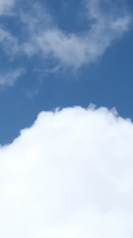 A calm, unobtrusive background with the sky and simple, cirrus clouds. Slowly moving clouds.