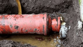 Close-up of Burst Sewer Pipe Emergency. Sewage and Wastewater Leak. a ruptured or overflowing sewer pipe, wastewater main, leaking effluent onto the ground. - Powered by Shutterstock - Get 15% off with code: PIKWIZARD15