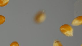 Slow motion macro video of corn kernels falling and forming a pile. Detailed close-up of golden maize grains used in food, cooking, and agricultural visuals. - Powered by Shutterstock - Get 15% off with code: PIKWIZARD15