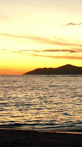 Silhouette of Man Watching Sunrise at Beach