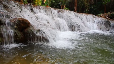 Waterfall in woods with water throughout the year. In Kanchanaburi.(2 clips.)