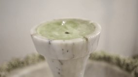 close up of marble holy water font with gentle ripples and flow - Powered by Shutterstock - Get 15% off with code: PIKWIZARD15