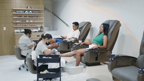 Young couple receiving a relaxing foot massage and pedicure treatment from professional manicurists - Powered by Shutterstock - Get 15% off with code: PIKWIZARD15