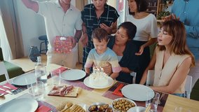 Storytelling image of a Family reunited at home for lunch on the holidays. Family members celebrating eating good food, sharing love and positive emotions. - Powered by Shutterstock - Get 15% off with code: PIKWIZARD15