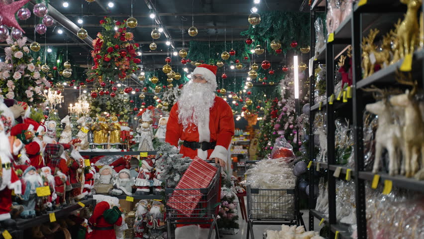Santa Claus pushing a shopping cart in a Christmas store
