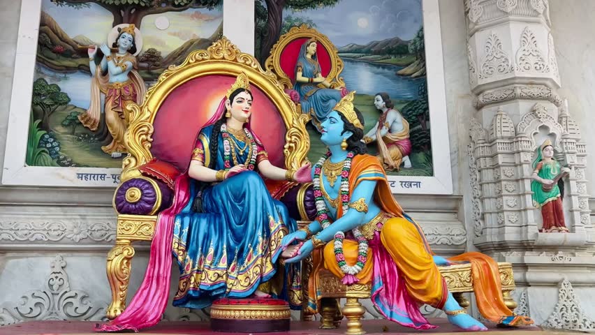 Beautiful sculpture showing Radha and Krishna embracing lovingly beside a river, symbolizing divine union and eternal love.