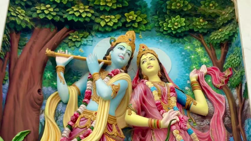 Beautiful idol of Radha and Krishna surrounded by radiant background, representing eternal love and devotion.