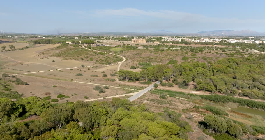 Aerial view of the Temple of Hera located at the archaeological site of Selinunte, in the province of Trapani, Sicily, Italy. The modern town is in the background.