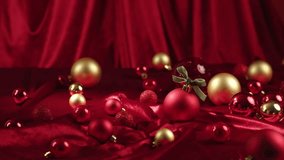 A rich collection of red and gold Christmas ornaments scattered across a luxurious, draped red satin fabric, creating a festive and elegant holiday scene. - Powered by Shutterstock - Get 15% off with code: PIKWIZARD15