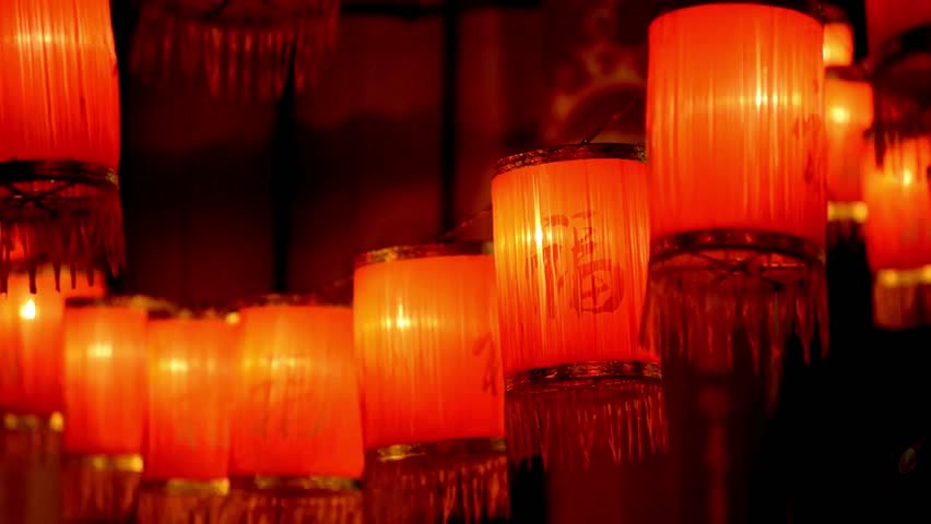 Vibrant red Chinese lanterns glow warmly at night, casting a festive and inviting ambiance for celebrations and cultural events