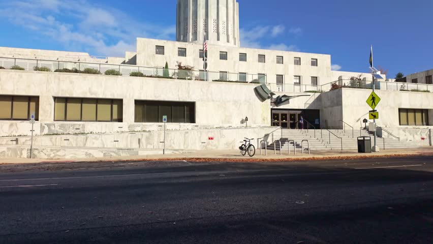 A grand exterior view of the Oregon State Capitol building in Salem, showcasing its unique Modernist and Art Deco architecture