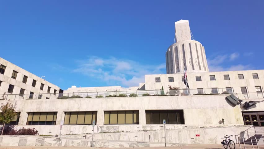 A grand exterior view of the Oregon State Capitol building in Salem, showcasing its unique Modernist and Art Deco architecture