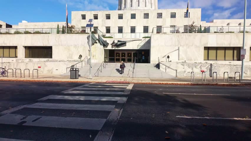 A grand exterior view of the Oregon State Capitol building in Salem, showcasing its unique Modernist and Art Deco architecture