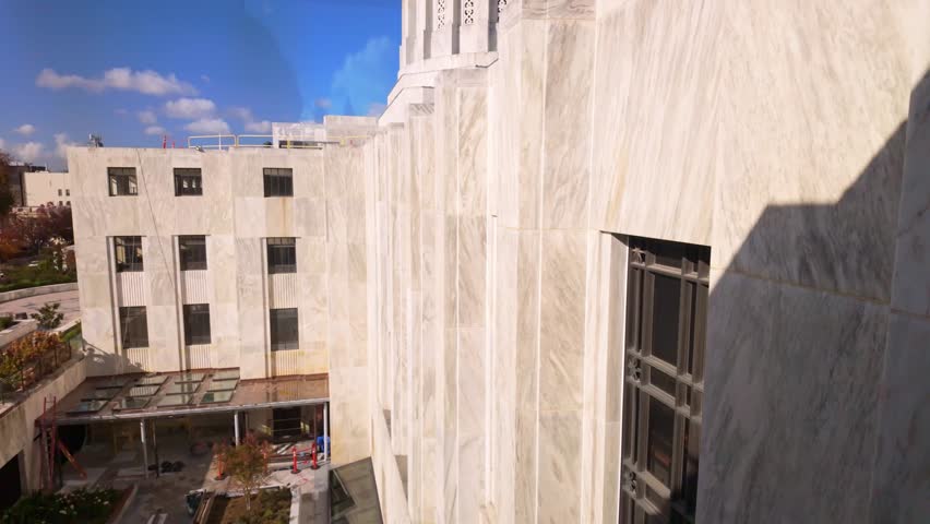 A grand exterior view of the Oregon State Capitol building in Salem, showcasing its unique Modernist and Art Deco architecture