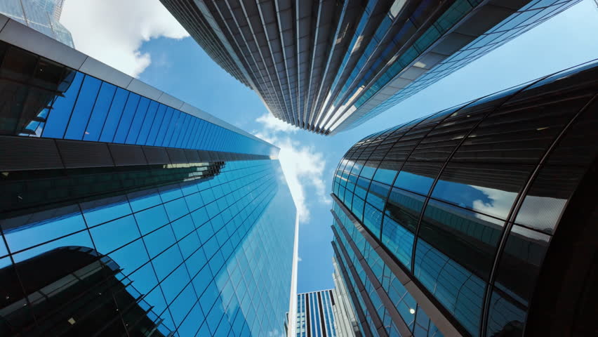 Bottom-up wide angle shot of important and futuristic skyscrapers in the financial center of London, England, UK
