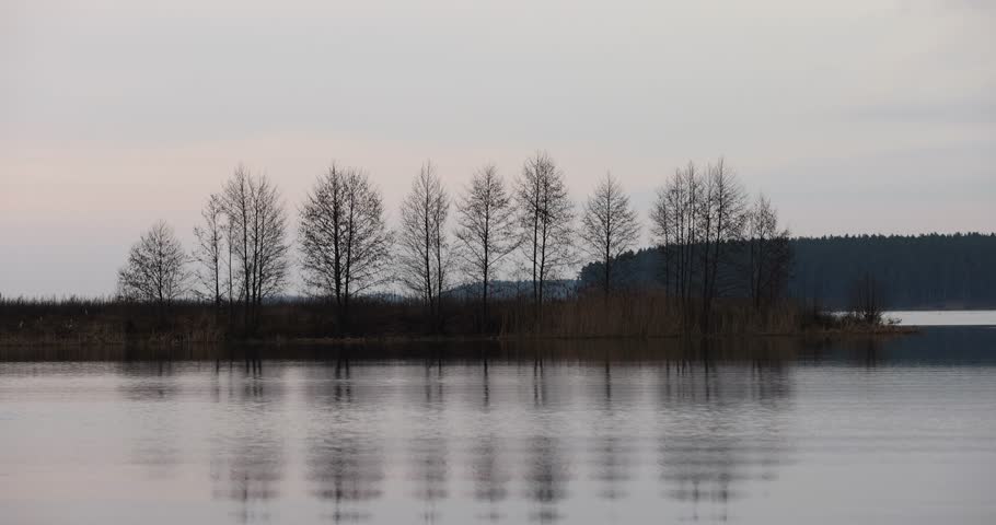 blue-gray clouds on the lake at sunset, a beautiful reflection of the sky and clouds in the lake at sunset