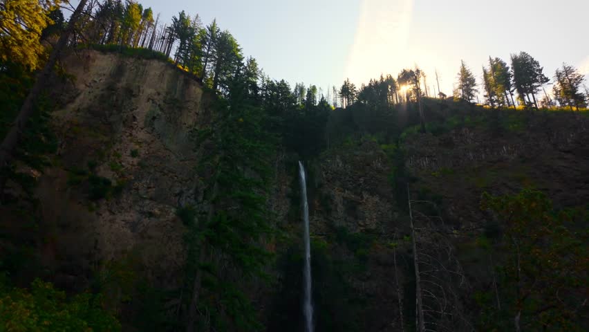A spectacular view of the colossal, two-tiered Multnomah Falls, spanning the upper and lower cascades within the stunning Columbia River Gorge National Scenic Area in Oregon