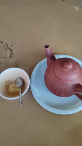Parakan temanggung, Central Java Oct 16, 2025
a teapot made of clay and a lump of rock sugar