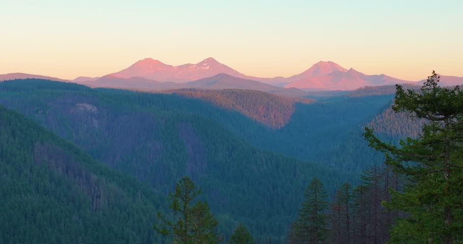 Drone video featuring the Three Sisters mountains during golden hour