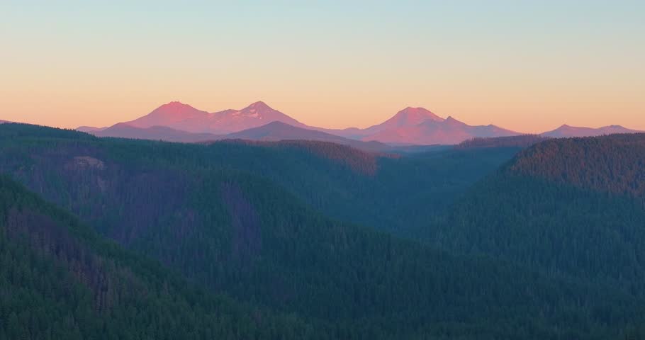 Aerial drone footage of Oregon’s Cascade Mountains and Three Sisters at sunset