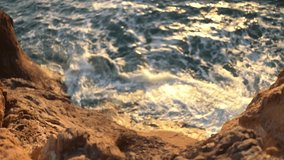 Crashing Waves Powerfully Hit Rugged Coastal Cliffs During Golden Sunset Vertical video - Powered by Shutterstock - Get 15% off with code: PIKWIZARD15