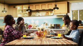 African american father rushing to eat something and leave for work, running late kissing his son and saying goodbye to his family. Preoccupied busy working dad hurrying for the office. Camera A. - Powered by Shutterstock - Get 15% off with code: PIKWIZARD15