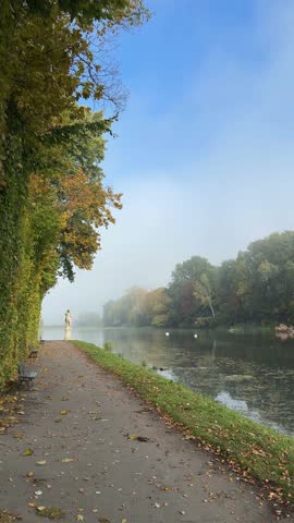 Autumn lake in royal park Wilanow in Warsaw, Poland in October sunny morning