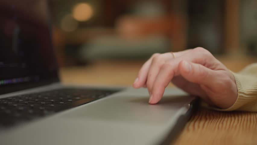 Close-up of hand typing on laptop, cozy workspace mood, soft lighting - Powered by Shutterstock - Get 15% off with code: PIKWIZARD15
