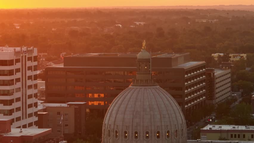 Dome of Boise, Idaho State Capitol Building, glowing orange during a warm sunset