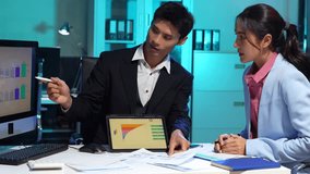 Businessmen team or financial data analysts working overtime with tablets and laptop computers and data graphs together. Plan to analyzing projects in the office. - Powered by Shutterstock - Get 15% off with code: PIKWIZARD15