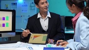 Businessmen team or financial data analysts working overtime with tablets and laptop computers and data graphs together. Plan to analyzing projects in the office. - Powered by Shutterstock - Get 15% off with code: PIKWIZARD15