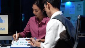 Businessmen team or financial data analysts working overtime with tablets and laptop computers and data graphs together. Plan to analyzing projects in the office. - Powered by Shutterstock - Get 15% off with code: PIKWIZARD15