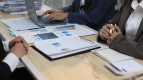 Businesswoman explaining financial chart during corporate meeting. Businesswoman gesturing with a pen discusses charts and graphs during a corporate meeting, colleagues in analysis and strategy. - Powered by Shutterstock - Get 15% off with code: PIKWIZARD15