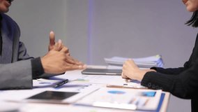 Business partners shaking hands after successful meeting, discussing financial results, analyzing sales diagrams, negotiating conditions of contract, expressing respect and trust, making deal. - Powered by Shutterstock - Get 15% off with code: PIKWIZARD15