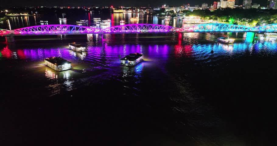 Aerial view of Truong Tien Bridge in Hue, Vietnam at night. This is a Gothic architectural bridge spanning the Perfume river from the 18th century designed by Gustave Eiffel